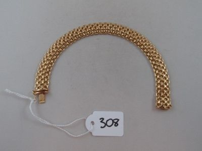 a gold chain bracelet with a price tag on it