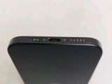 the back view of a black iphone with a camera attached to the back of it
