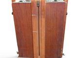 a wooden cabinet with two doors open on a white background