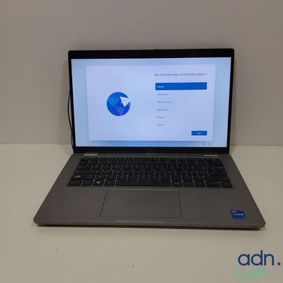 a laptop computer sitting on a table with a pie chart on the screen