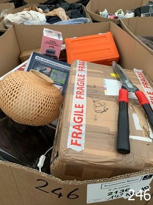 a cardboard box filled with assorted items for sale