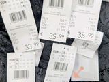 a lot of price tags that are on a dress