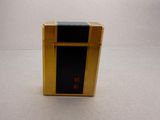 a small box that has a black and gold design on it