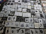 a lot of pictures on the table with a lot of them
