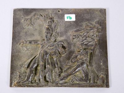 une image représentant une plaque métallique sur laquelle figurent un homme et une femme