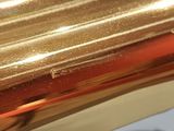 a close up view of a brass pipe on a table