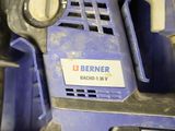 a close up of a blue machine with a label on it