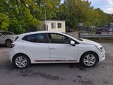 a picture of a white car parked in a parking lot