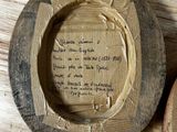 a picture of a piece of wood with writing on it