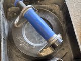 a tool in a case that is sitting on the floor