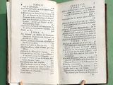 a book that is open on a stand on a table