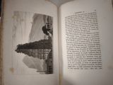 an open book with a picture of a train on it