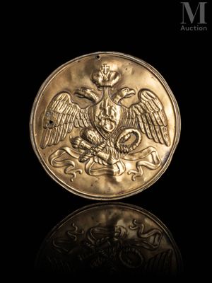 a close up of a gold coin with an eagle on it