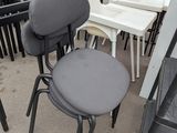 many chairs and a table in a room