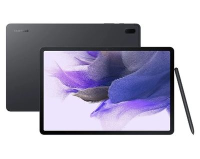 a tablet with a pen sitting on top of it next to a purple flower