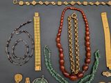 several pieces of jewelry including a necklace, bracelet, broochet, and other items