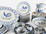 a lot of plates and cups and saucers on the table