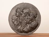 an image of a bronze plaque of a group of people
