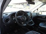 a view of the inside of a car from the driver ' s seat