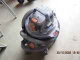 a vacuum that is sitting on the floor in a room