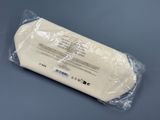 a close up of a piece of cheese wrapped in plastic on a table