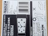 a black and white picture of a box with a clock on it