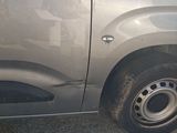 a car that has a flat tire on the side of the road