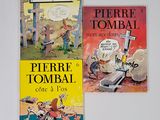 trois livres pour enfants sont posés sur une surface blanche