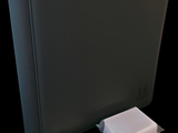 an image of a black binder with a keyboard and a mouse