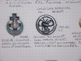 some pins on a piece of paper with writing on it