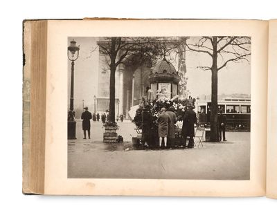 an old photo of a group of people on the street