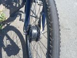 a blue bicycle parked on the side of the road