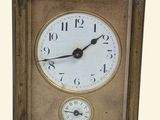 a small clock that is sitting on a table