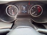 a close up of a car dashboard with various gauges