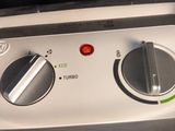 a close up of a stove top with a control panel