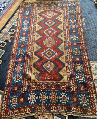 a large rug with many different colors and patterns on it