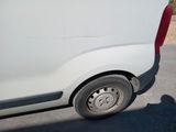 a white van parked on the side of the road
