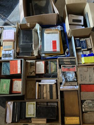 a lot of boxes and boxes of books on the floor