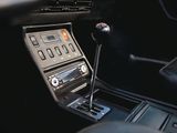 the interior of a car with a steering control and dashboard controls