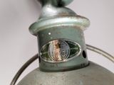 a close up of a light that is on a pole
