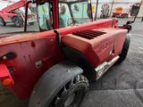 a red truck that is parked in a parking lot