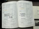 an open book with a list of cars on it
