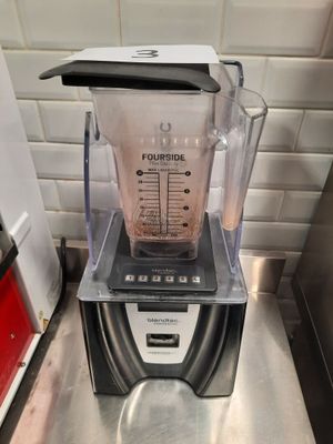 a blender that is sitting on a counter in a kitchen