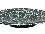a black and white bowl with a blue design on it