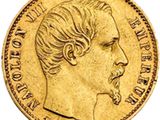 a close up of a gold coin with a man ' s face on it