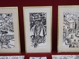 trois dessins en noir et blanc sur un fond rouge