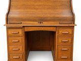 an antique oak roll top desk with drawers
