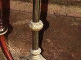 a candle that is sitting on a table next to a chair