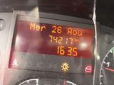 a digital clock on the dashboard of a car