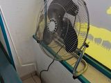 a fan that is sitting in front of a window